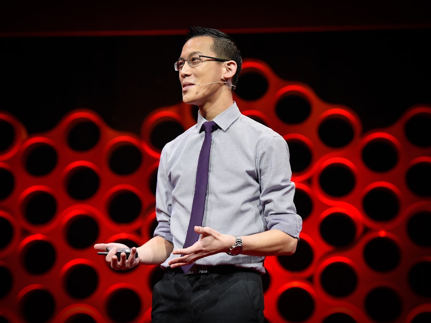 caption: Eddie Woo on the TED stage.