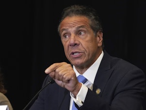 caption: New York Gov. Andrew Cuomo speaks during a news conference last month at New York City's Yankee Stadium. The governor has announced he will step down by Aug. 24.