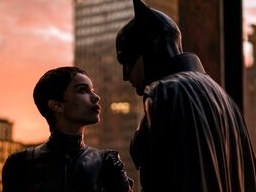 caption: This image released by Warner Bros. Pictures shows Zoe Kravitz, left, and Robert Pattinson in a scene from "The Batman."