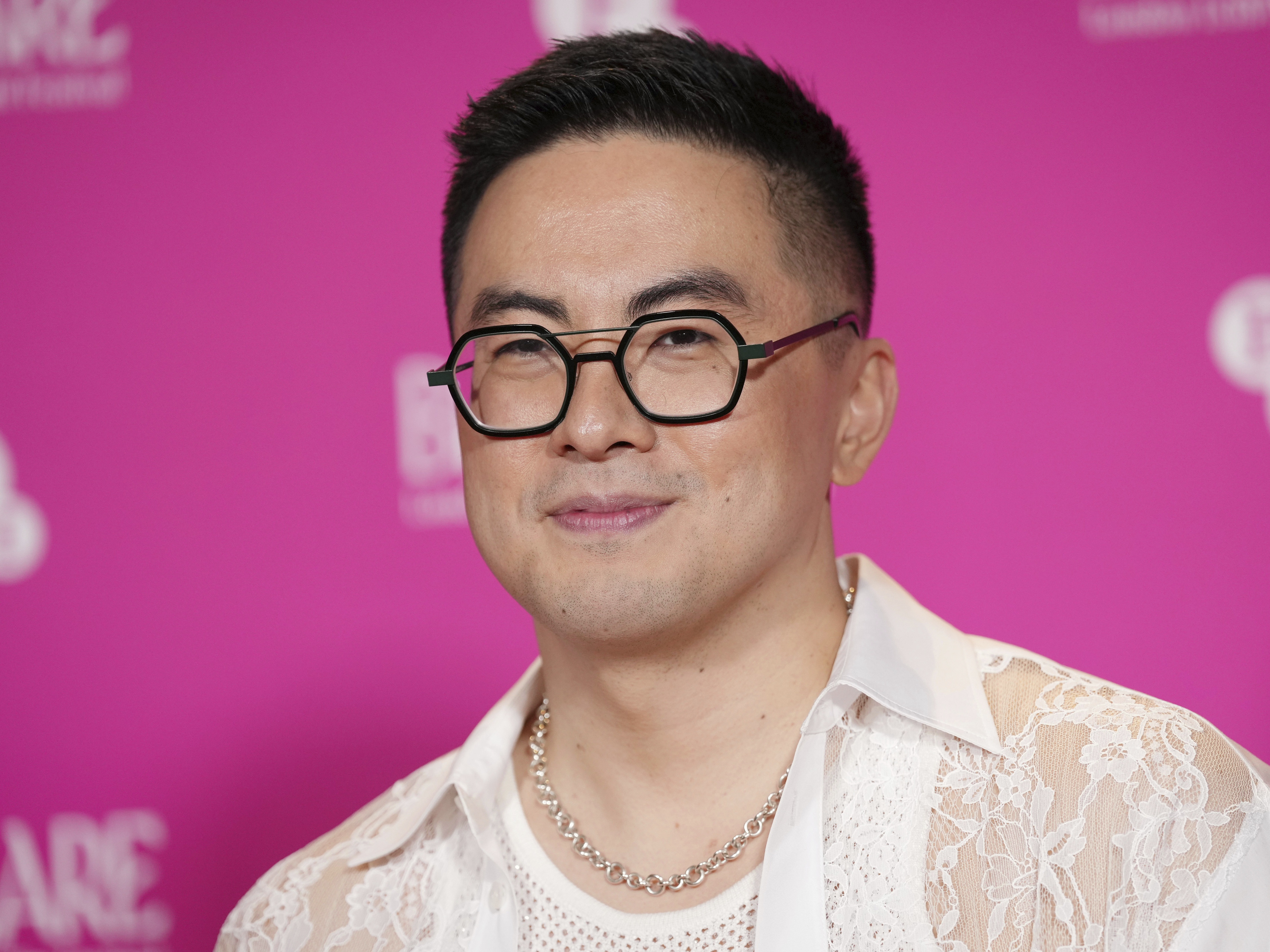 caption: Bowen Yang poses for photographers upon arrival at the BFI Flare Opening Gala for the film <em>The Wedding Banquet</em> in London, March 19, 2025.