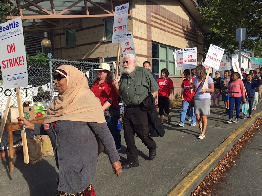 caption: Teachers strike outside Orca K-12 in Columbia City on Wednesday. Seattle Public Schools remains closed Monday as negotiations continue.