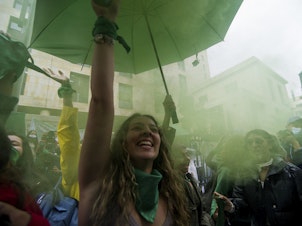caption: Demonstrators who support abortion rights celebrate outside the Constitutional Court in Bogota, Colombia on February 21. After an 8-hour debate, the court decriminalized abortions during the first 24 weeks of pregnancy.