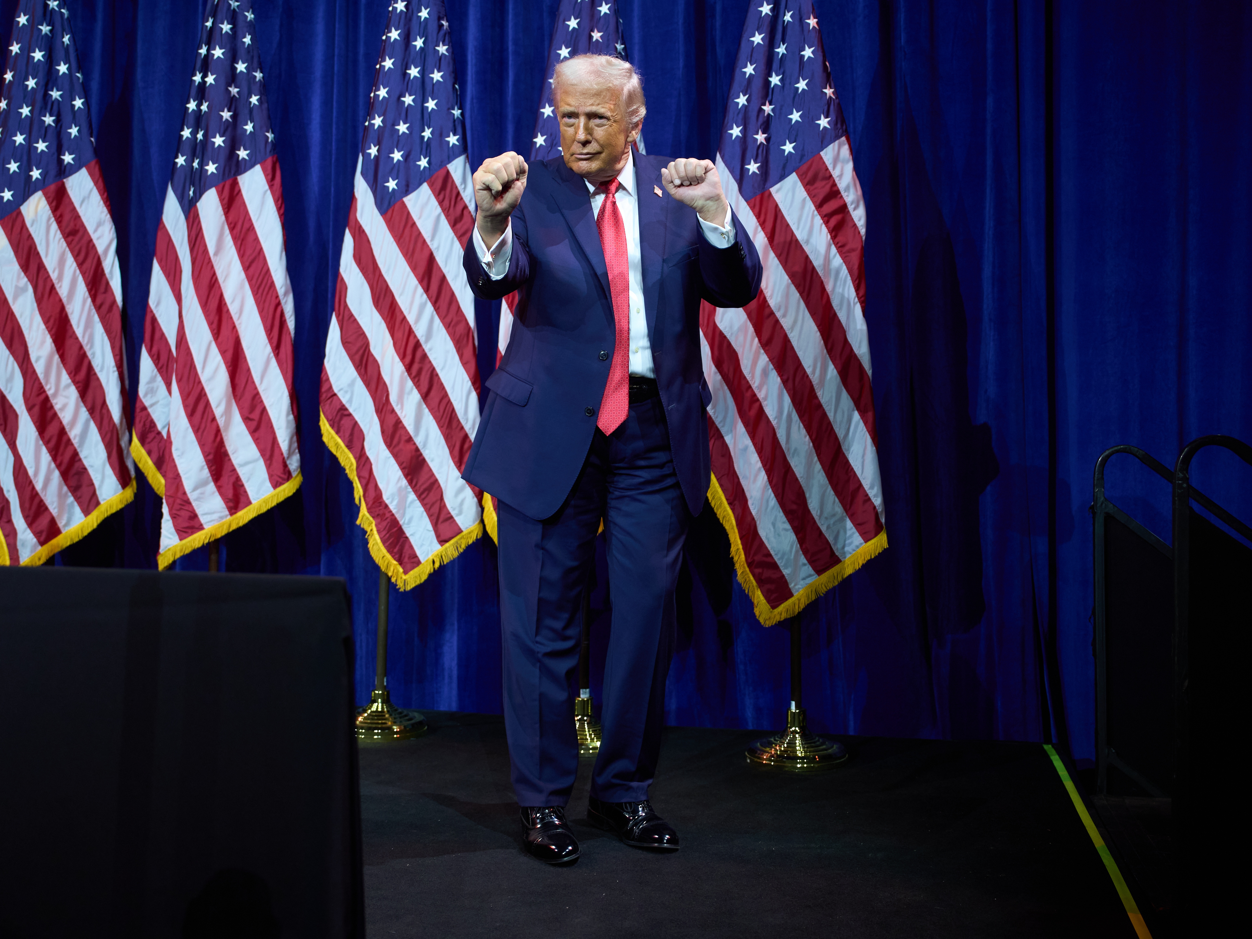 caption: President Donald Trump dances as he walks off stage after speaking to House Republican lawmakers during their annual policy retreat, Tuesday, Jan. 6, 2026, in Washington.