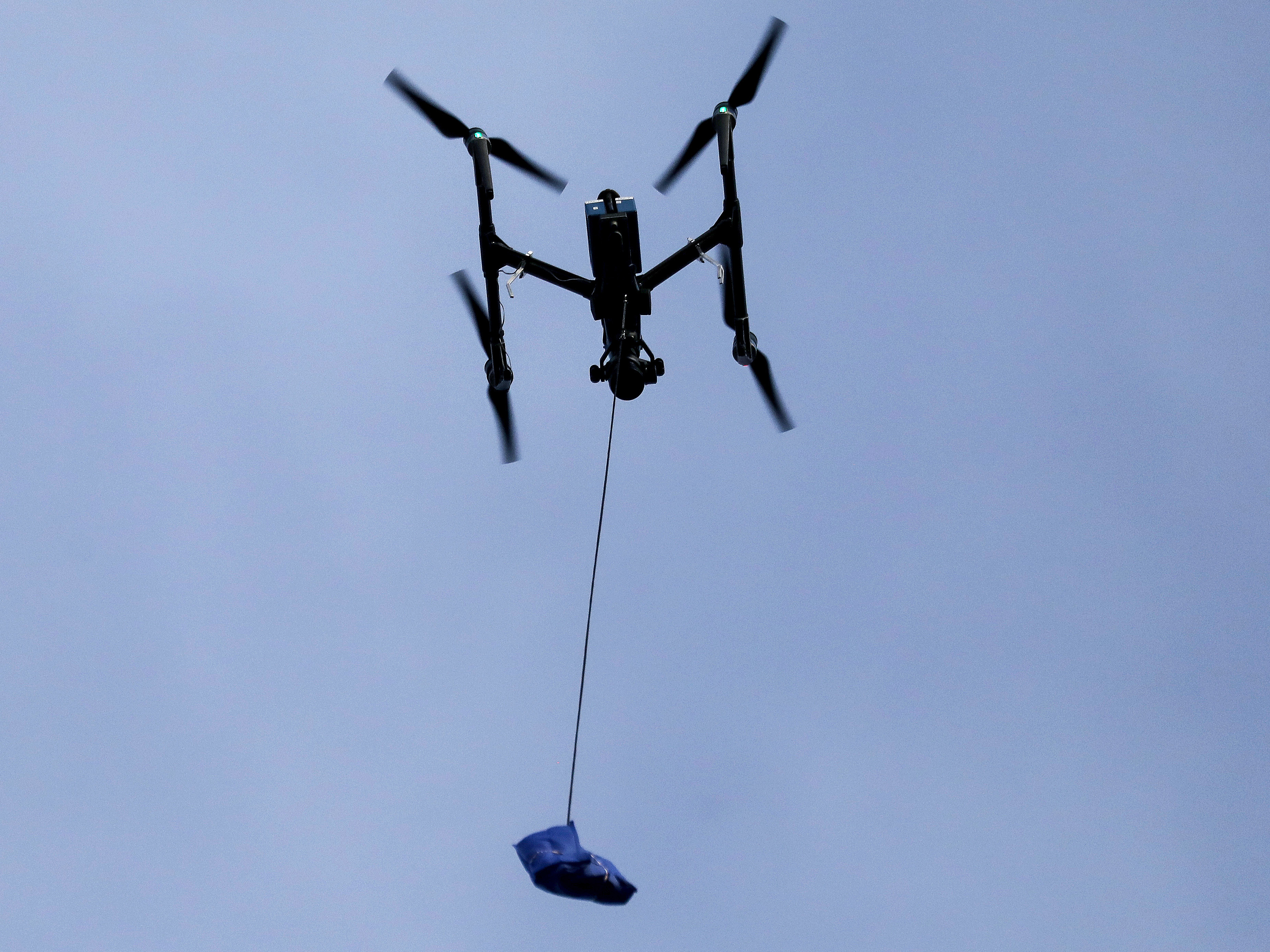 caption: The Federal Aviation Administration announced new rules Monday that would ease restrictions on the use of drones and will likely expand commercial uses of the technology down the road.