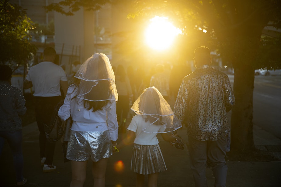 caption: Democratic Oregon State Rep. Andrea Valderrama, left, walks with her 8-year-old daughter, Rosalia, and her daughter's father, Huy Ong, right, toward Lumen Field for Beyonce’s Seattle stop on the Renaissance World Tour on Thursday, Sept. 14, 2023, in Seattle. 