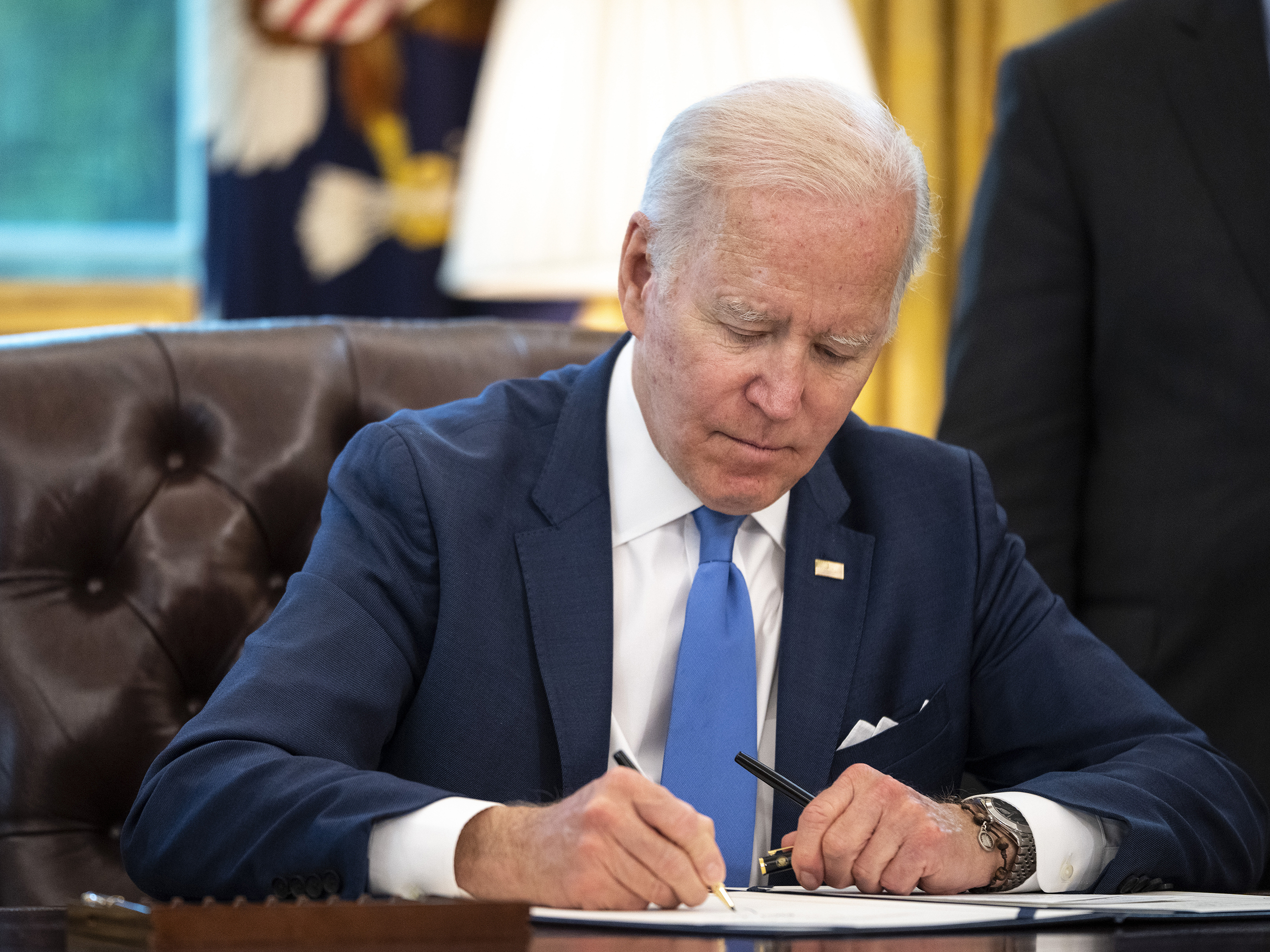 caption: President Biden signed the Safe Sleep for Babies Act of 2021 on Monday, outlawing the manufacture and sale of crib bumpers and certain inclined infant sleepers.