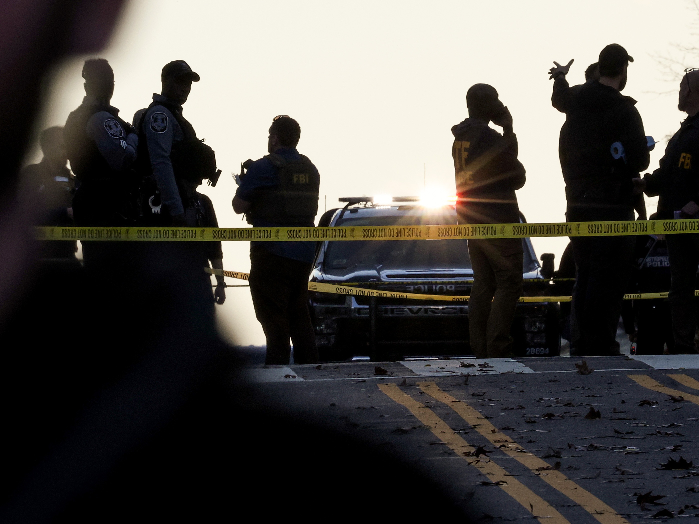 caption: Members of law enforcement, including the U.S. Secret Service and the Washington Metropolitan Police Department, respond to a shooting near the White House on November 26, 2025 in Washington, DC. Two West Virginia National Guard members  were shot blocks from the White House.