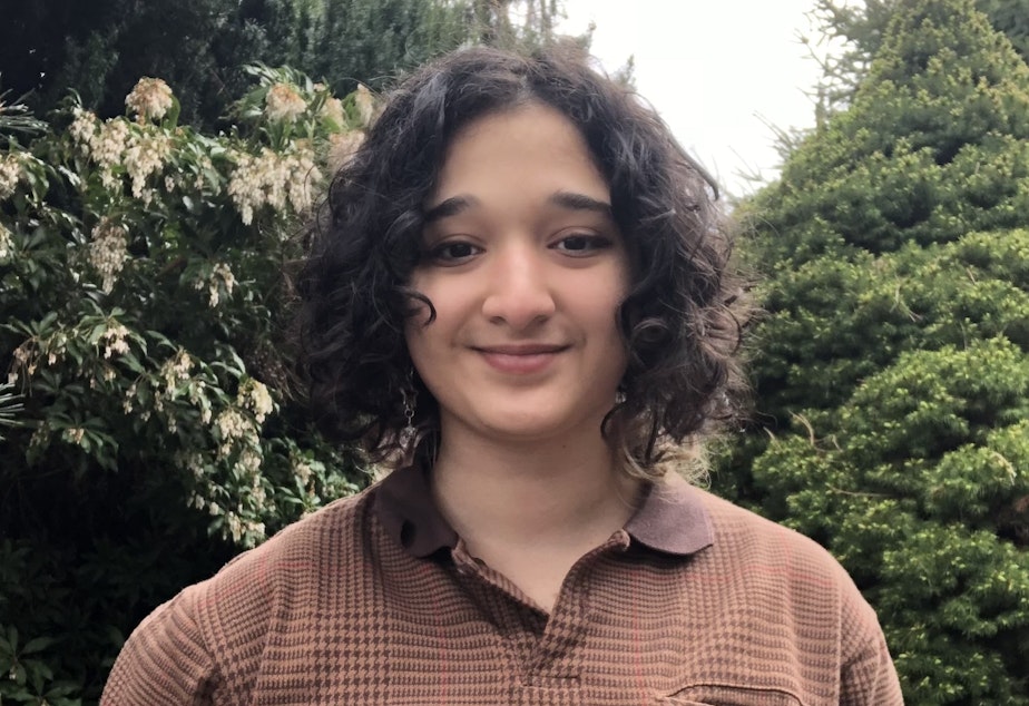 caption: Rona Eslamy, 18, graduated from Roosevelt High School in Seattle on June 14, 2022. They wrote a column for the student newspaper on the complicated feelings at that big moment in life. 