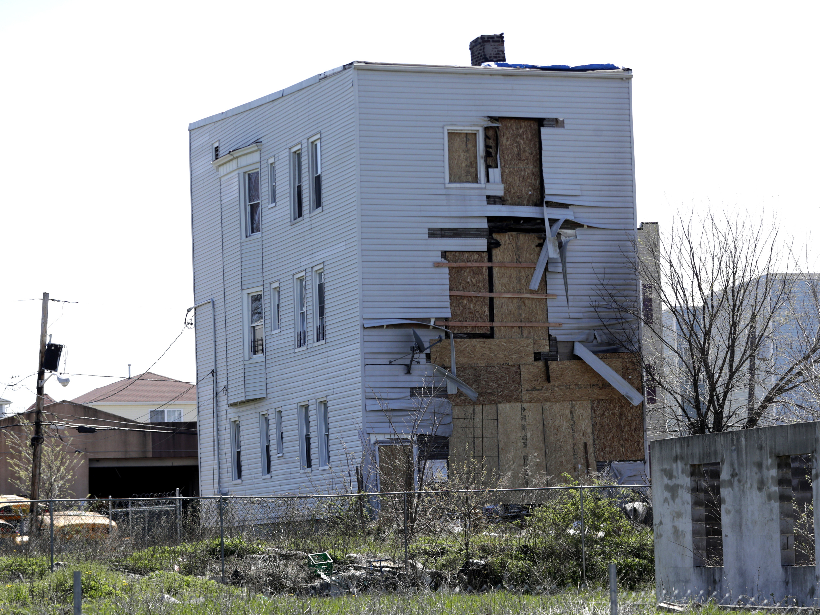 caption: A building in Newark, N.J., stands near a construction site in a so-called "opportunity zone" in April 2018. The program to spur investment in low-income communities originated in the 2017 tax law.
