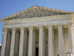caption: The Supreme Court heard arguments in a case examining a federal-state conflict over emergency abortions.