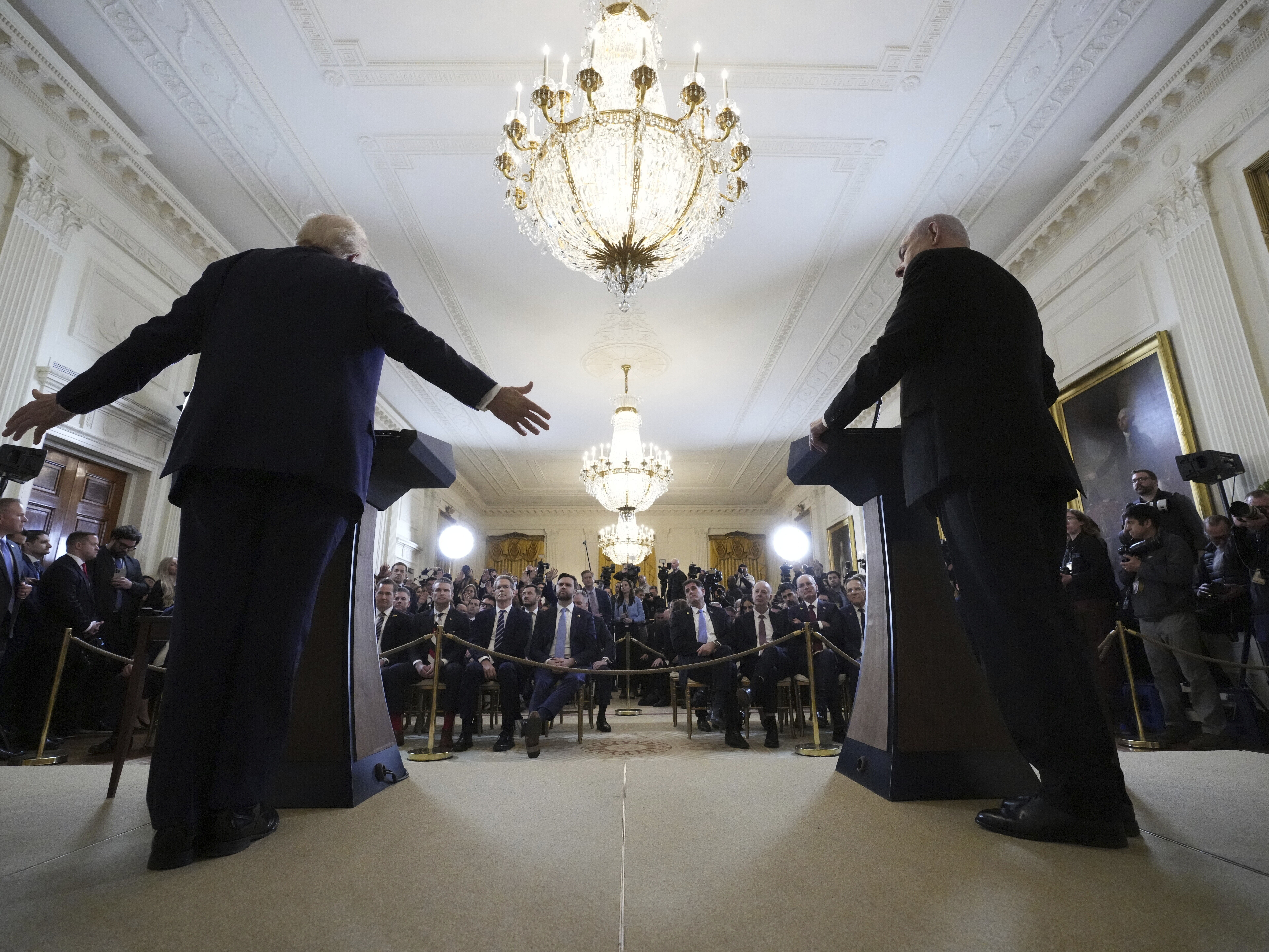 caption: President Trump and Israeli Prime Minister Benjamin Netanyahu speak during a news conference in the East Room of the White House on Tuesday.
