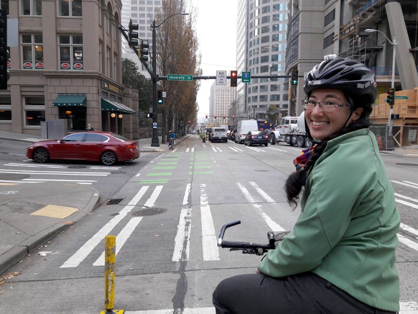caption: Clara Cantor, of Seattle Neighborhood Greenways, on downtown Seattle's 2nd Avenue protected bike lane.