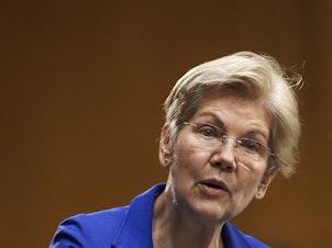 caption: Sen. Elizabeth Warren speaks during a Senate Finance Committee hearing in Washington on Feb. 24. Warren's latest book is called <em>Persist</em>.