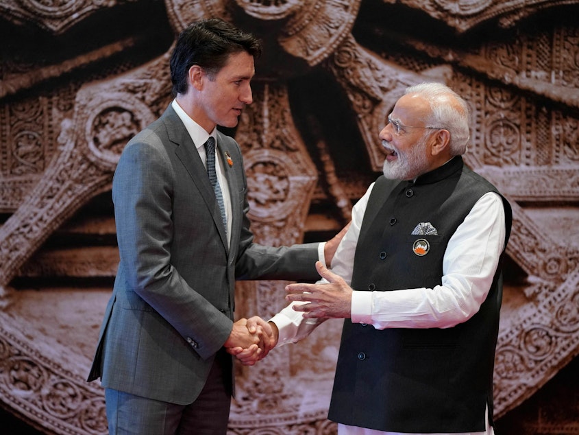 caption: Canada's Prime Minister Justin Trudeau, left, shakes hands with India's Prime Minister Narendra Modi ahead of the G20 Leaders' Summit in New Delhi on Sept. 9, 2023.