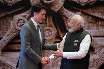 caption: Canada's Prime Minister Justin Trudeau, left, shakes hands with India's Prime Minister Narendra Modi ahead of the G20 Leaders' Summit in New Delhi on Sept. 9, 2023.