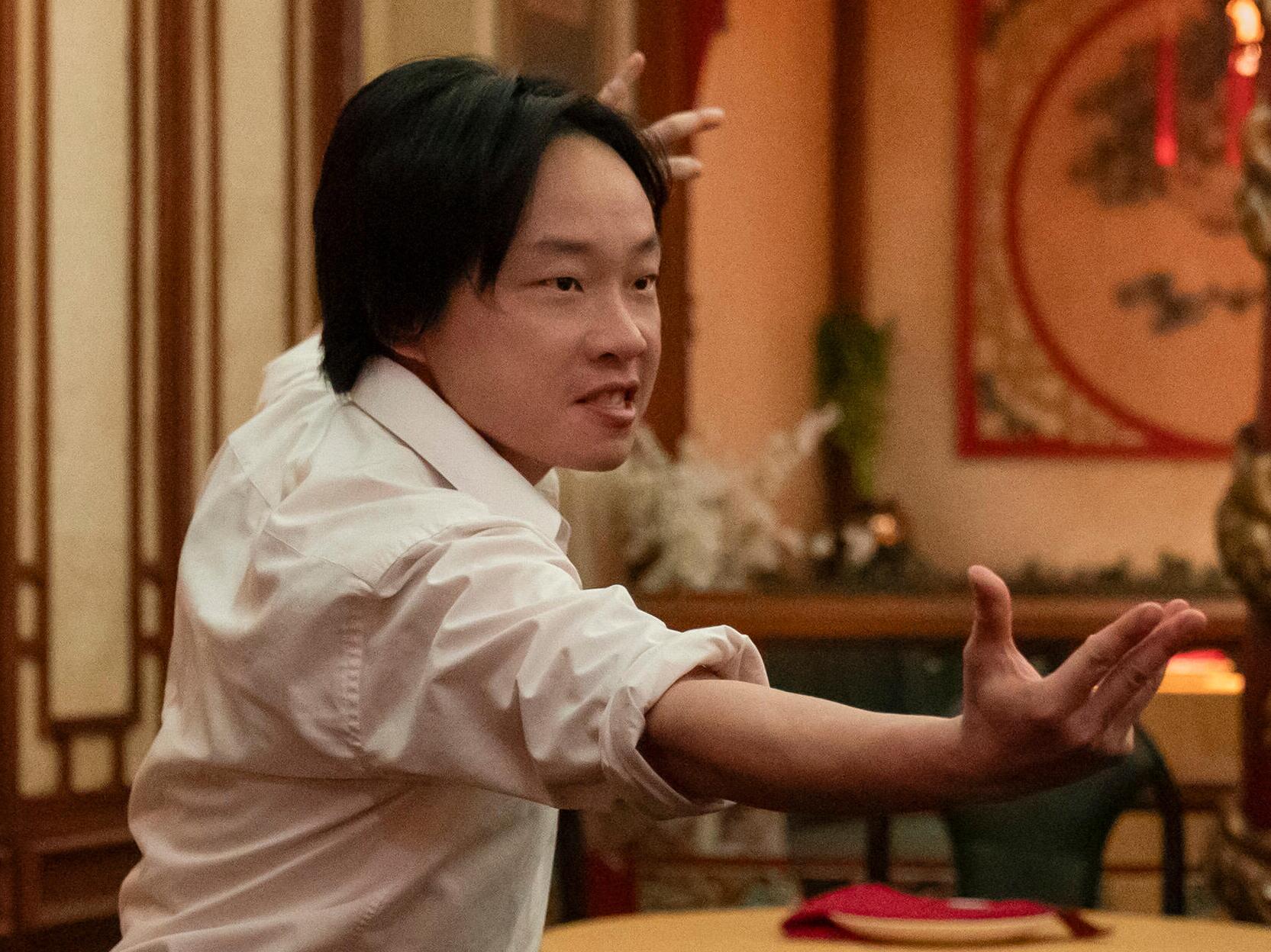 caption: Jimmy O. Yang plays a waiter who finds himself embroiled in a mystery in <em>Interior Chinatown.</em>