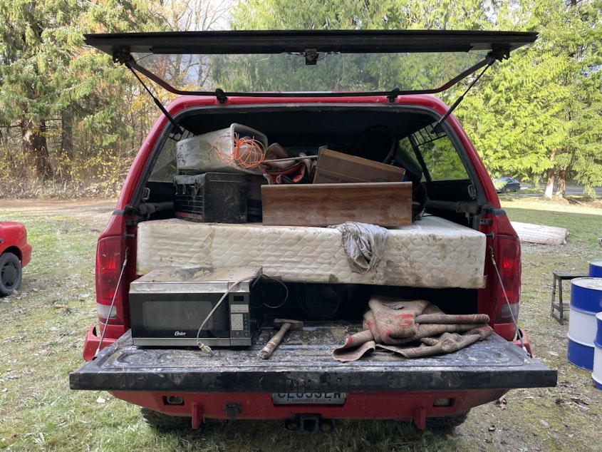 caption: AJ Van Dyke's pickup full of garbage