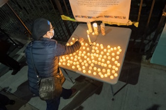 caption: The U.S. death toll from COVID-19 hit a new milestone, surpassing the number of Americans who died in the prolonged conflict with Vietnam. Here, the Elmhurst Hospital Center in Queens, N.Y., holds a vigil for medical workers and patients who have died in the pandemic.