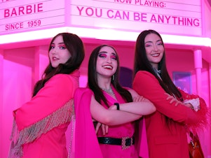 caption: Kelsey, Kristen and Kaylen Kassab of The K3 Sisters Band in front of the Barbie Theater at World of Barbie at Stonebriar Centre Mall on in Frisco, Texas.