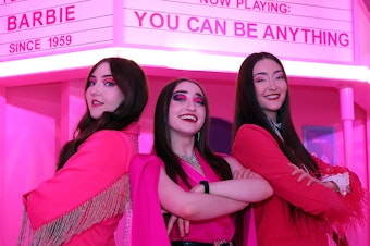 caption: Kelsey, Kristen and Kaylen Kassab of The K3 Sisters Band in front of the Barbie Theater at World of Barbie at Stonebriar Centre Mall on in Frisco, Texas.