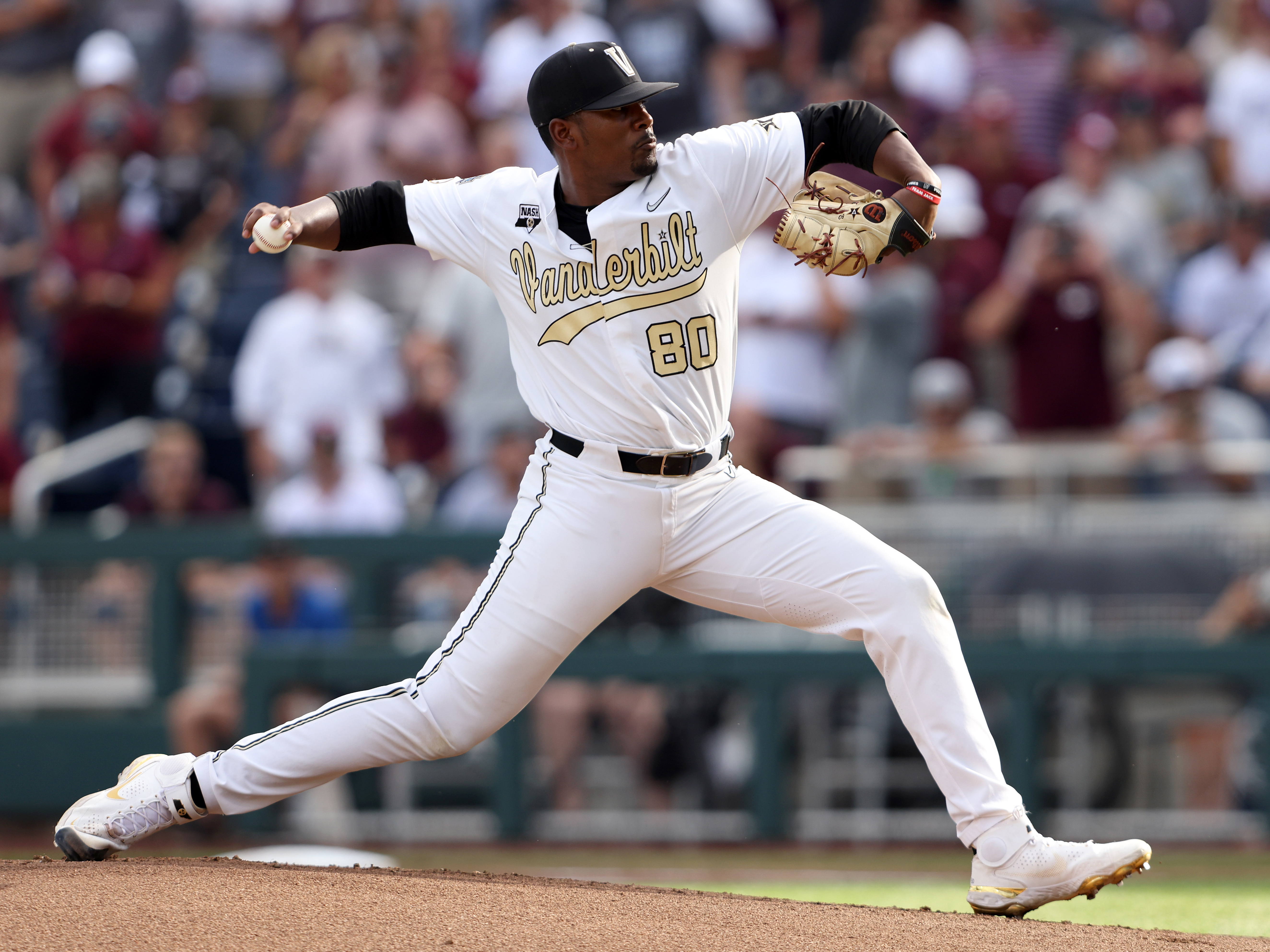 caption: Kumar Rocker pitches during game three of the College World Series championship on June 30, 2021, in Omaha, Neb. This week, he was drafted by the New York Mets.