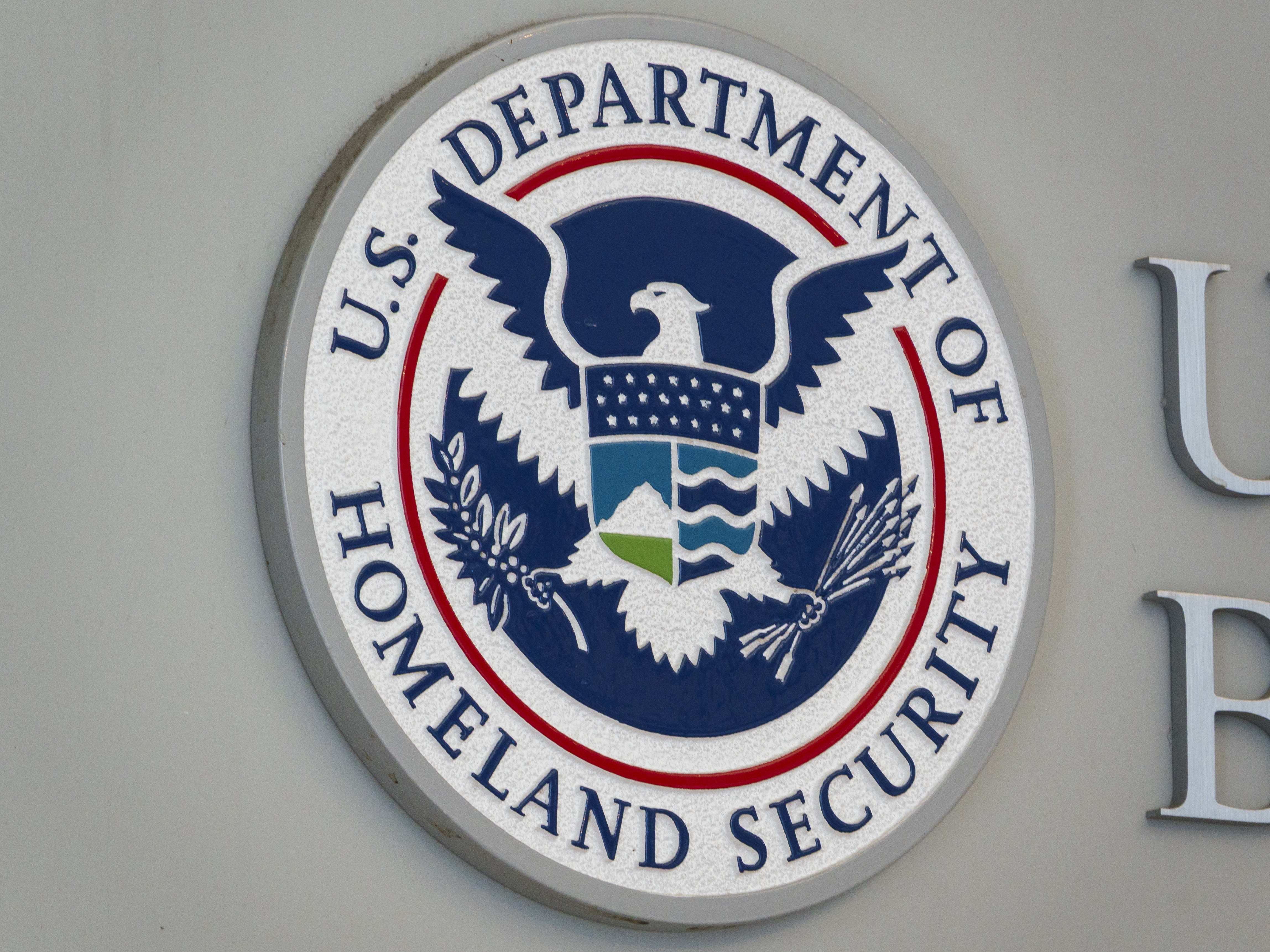 caption: A U.S. Department Of Homeland Security and U.S. Customs and Border Protection sign is displayed at the U.S. Customs and Border Protection Headquarters on May 18 in Washington, D.C.