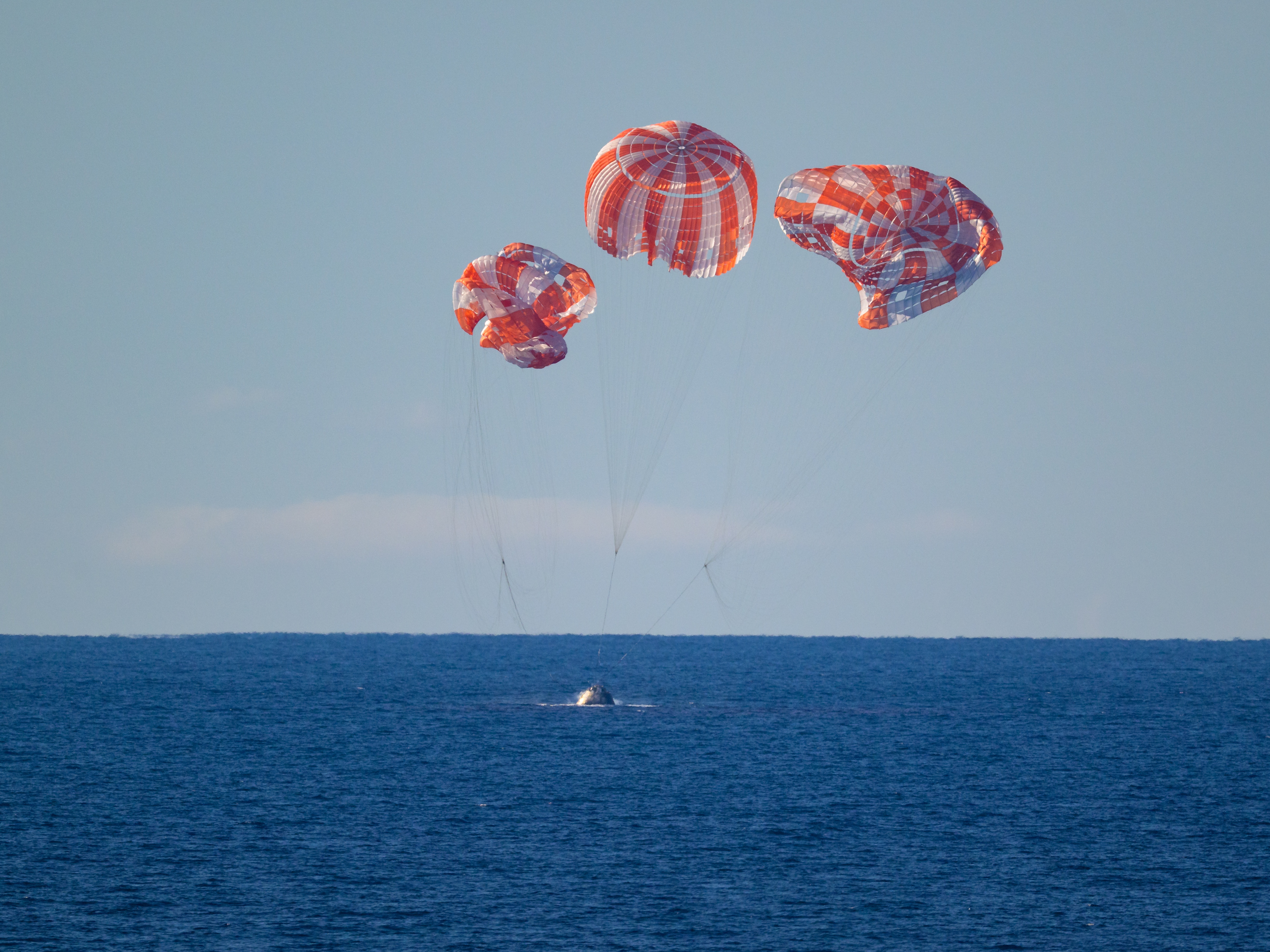 caption: The Artemis II crew — NASA astronauts Reid Wiseman, Victor Glover, and Christina Koch as well as Canadian Space Agency astronaut Jeremy Hansen — splashed down in an Orion space capsule Friday after a 9-day mission to the moon and back.