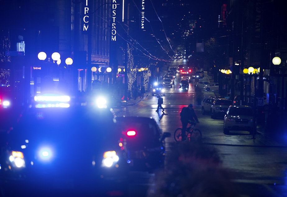 Patrol cars and ambulances are shown at the intersection of Third Avenue and Pine Street on Wednesday, January 22, 2020, following a shooting that left multiple victims injured and one dead in Seattle.