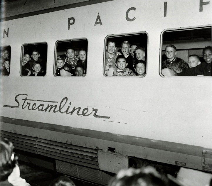 caption: From 'Seattle on the Spot,' a book of photographs by Al Smith: This is the 'International Fighting Irish youth football team leaving Seattle to play a championship game in Las Vegas in 1954. (To help us ID these children, note the photo number. This is #7.)