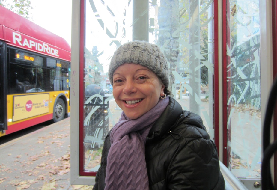 caption: Poet Nora Giron-Dolce at a Seattle bus stop.