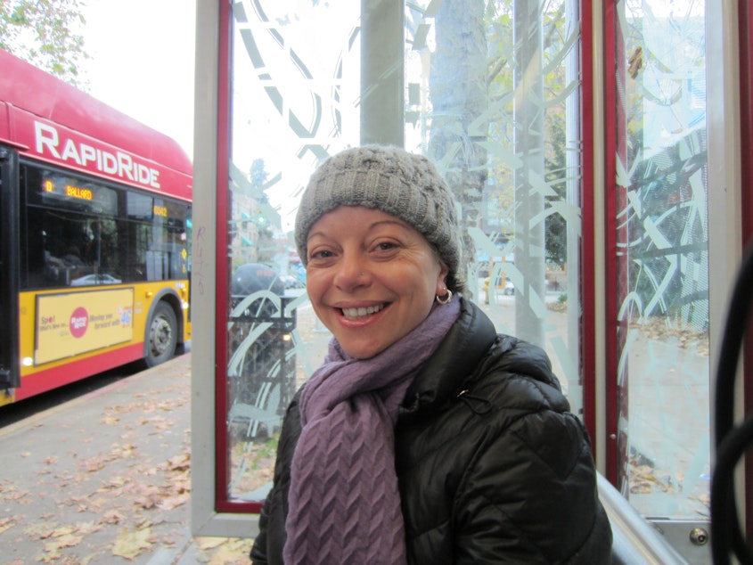 caption: Poet Nora Giron-Dolce at a Seattle bus stop.