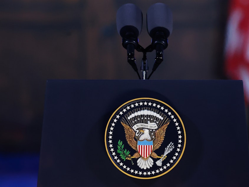 caption: Seal of the President of the United States symbol is seen on a podium before the remarks of the President of the United States Joe Biden at the Royal Castle Gardens in Warsaw, Poland on February 21, 2023.