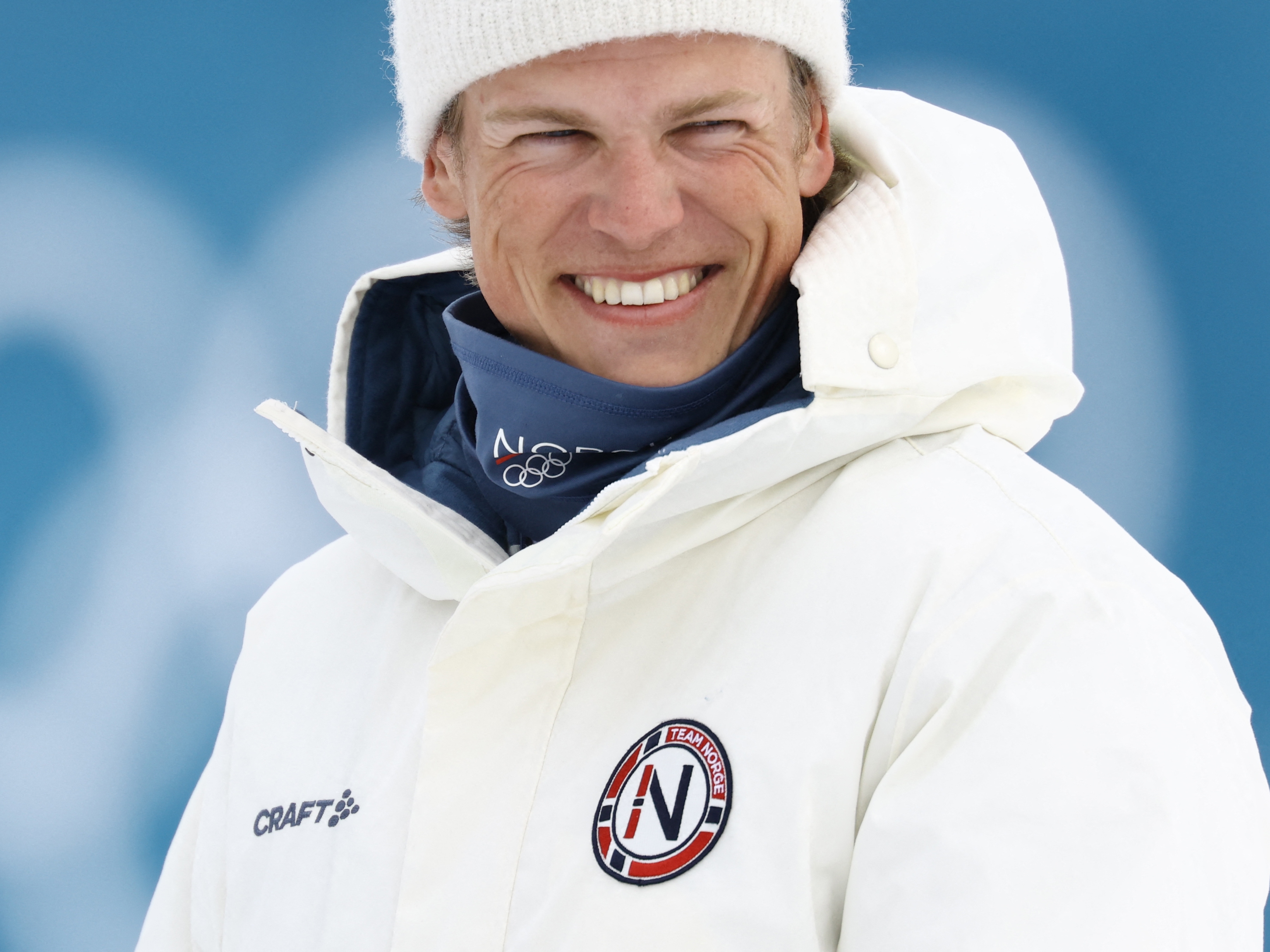 caption: Gold medallist Norway's Johannes Hoesflot Klaebo smiles as he celebrates during a podium ceremony for the men's cross country 50km mass start final event of the Milano Cortina 2026 Winter Olympic Games at Tesero Cross-Country Skiing Stadium in Lago di Tesero (Val di Fiemme) on February 21, 2026.