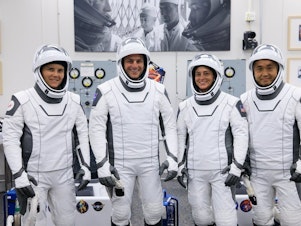 caption: Nicole Mann (second from right) is scheduled to be the mission commander on the SpaceX Dragon spacecraft on Wednesday.