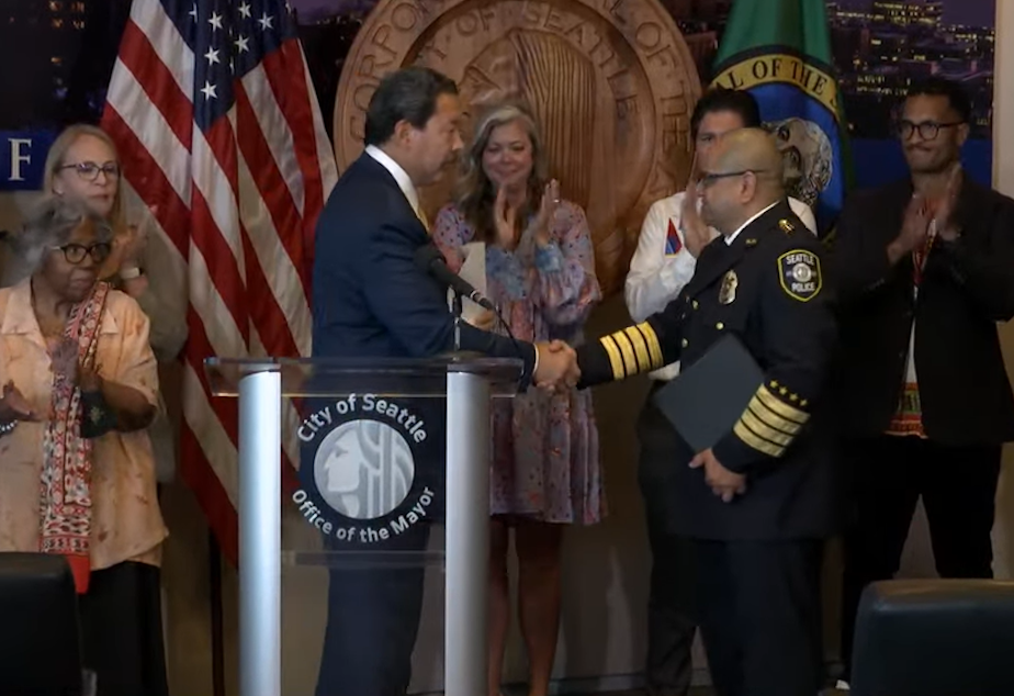 caption: Mayor Bruce Harrell announced that Adrian Diaz would become Seattle's next official police chief. Diaz was interim chief for two years before he was hired to the job. 