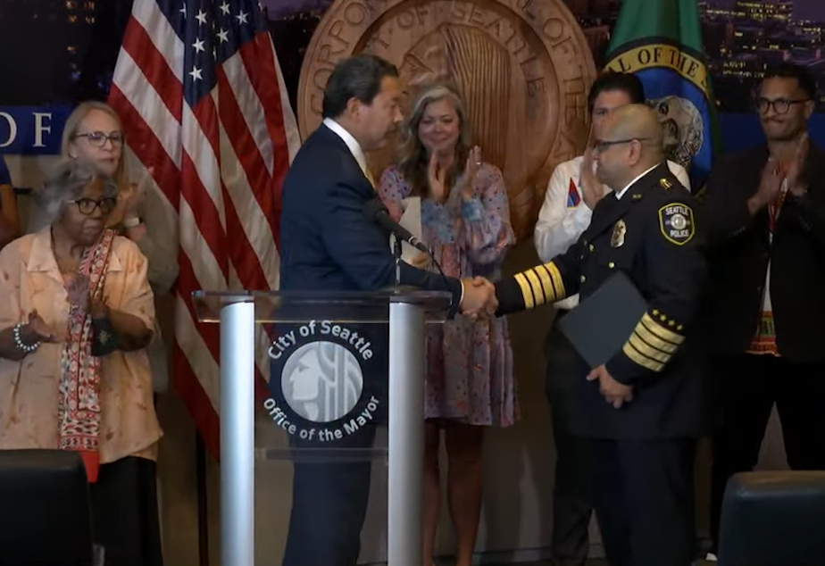 caption: Mayor Bruce Harrell announced that Adrian Diaz would become Seattle's next official police chief. Diaz was interim chief for two years before he was hired to the job.