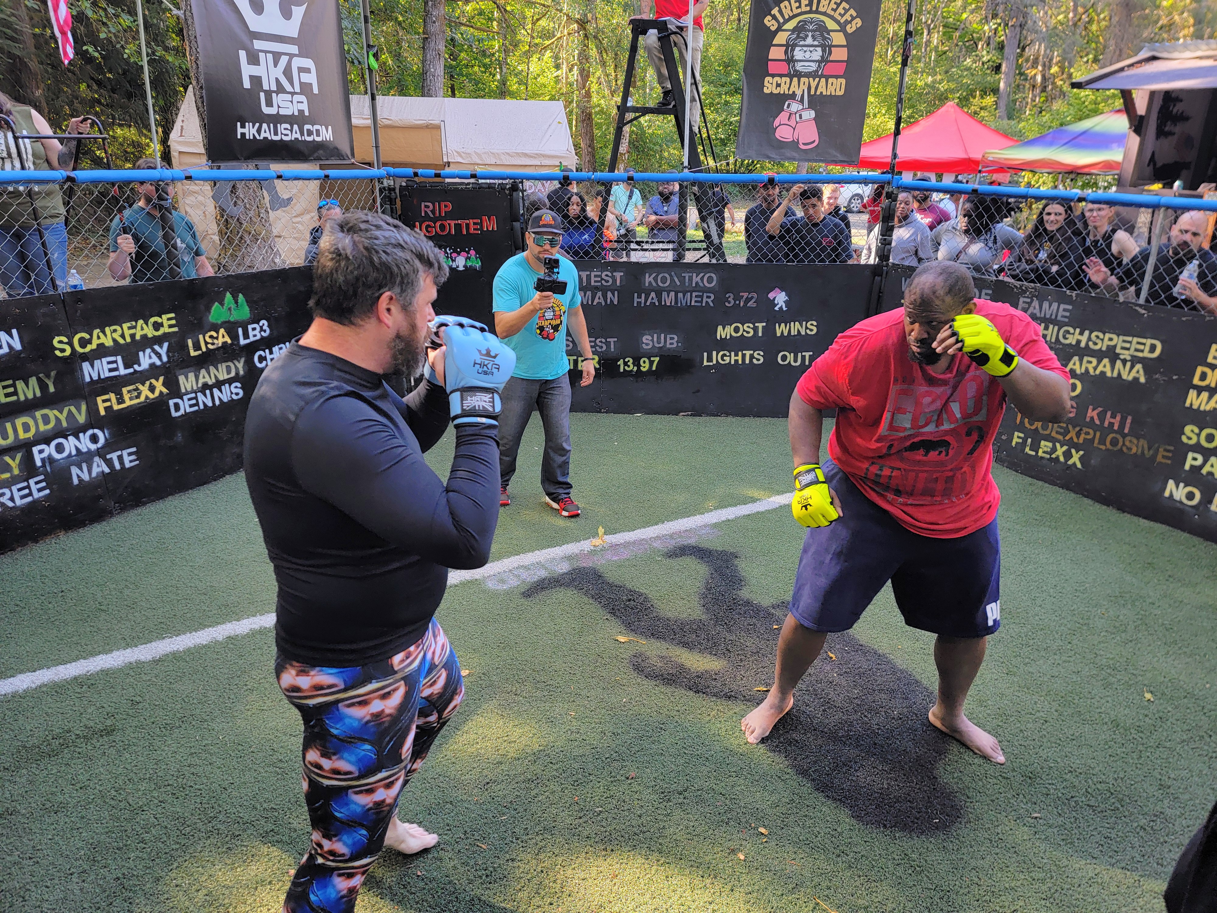 caption: Curtis Muldrow (right) and John McLellan beef in the Scrapyard on Saturday, Sept. 20, 2025.