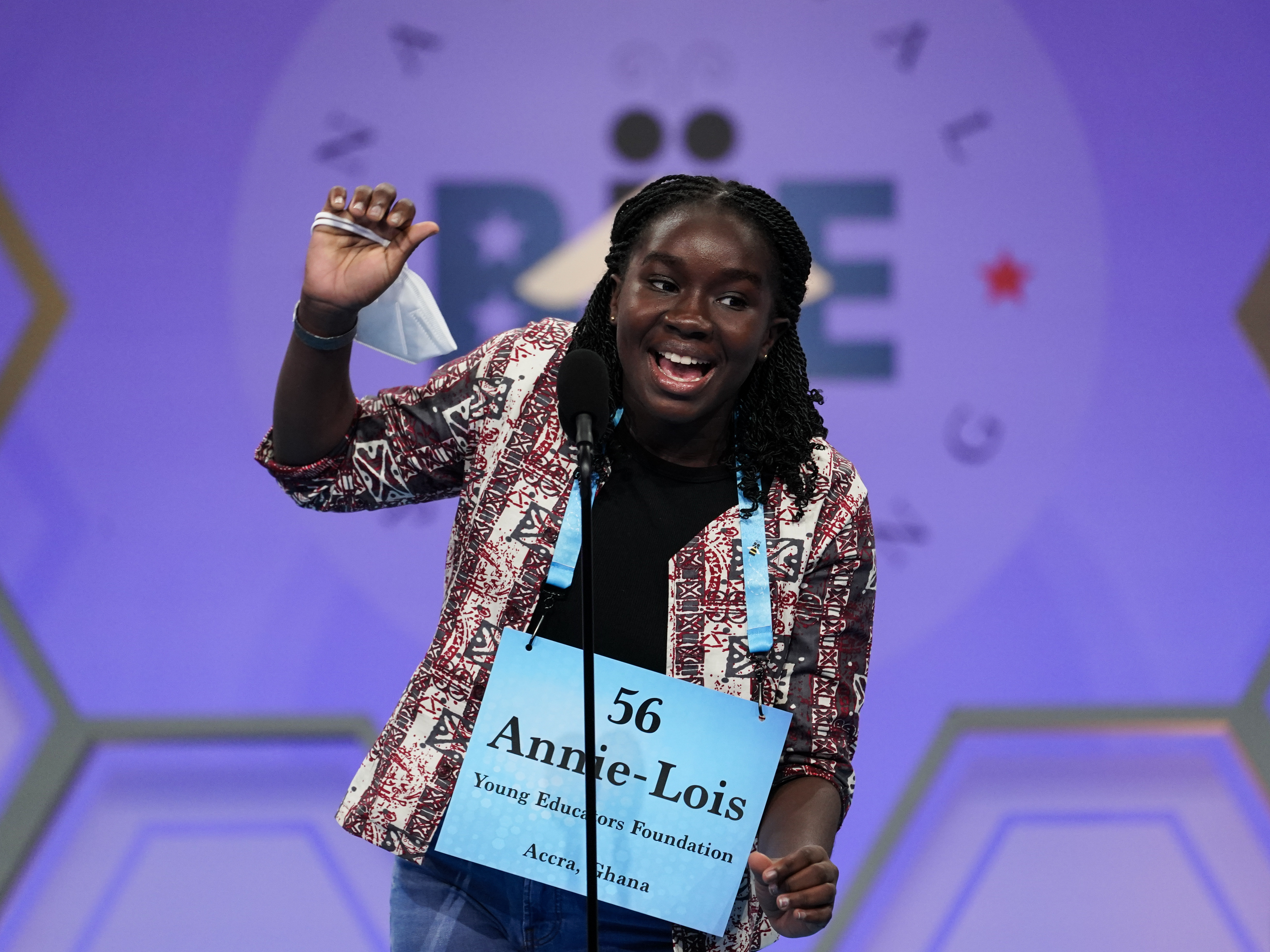caption: Annie-Lois Acheampong, 13, from Accra, Ghana, reacts during the Scripps National Spelling Bee on Tuesday in Oxon Hill, Md.