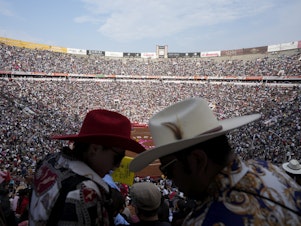 caption: Spectators wait for the start of a bullfight at the Plaza México, in Mexico City, Jan. 28. Bullfighting returned to Mexico City after the Supreme Court of Justice overturned a 2022 ban that prevented these events from taking place in the capital.