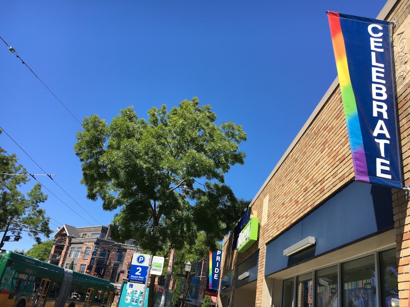 caption: Streets signs on Broadway in Capitol Hill, where Seattle's PrideFest is taking on a neighborhood event Saturday. 