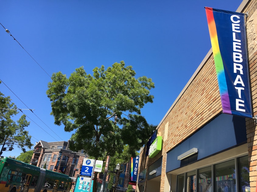 caption: Streets signs on Broadway in Capitol Hill, where Seattle's PrideFest is taking on a neighborhood event Saturday.