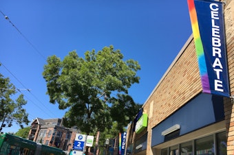 caption: Streets signs on Broadway in Capitol Hill, where Seattle's PrideFest is taking on a neighborhood event Saturday. 
