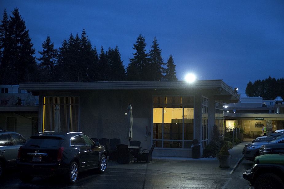 caption: Evening falls on the Life Care Center of Kirkland, the epicenter of the coronavirus outbreak in Washington state, on Thursday, March 5, 2020, in Kirkland.