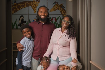 caption: Teresa Cox-Bates and her husband John Bates, along with their kids Eli, Ava and Issac. Teresa says HealthySteps has helped her face her own childhood trauma and be a better parent.