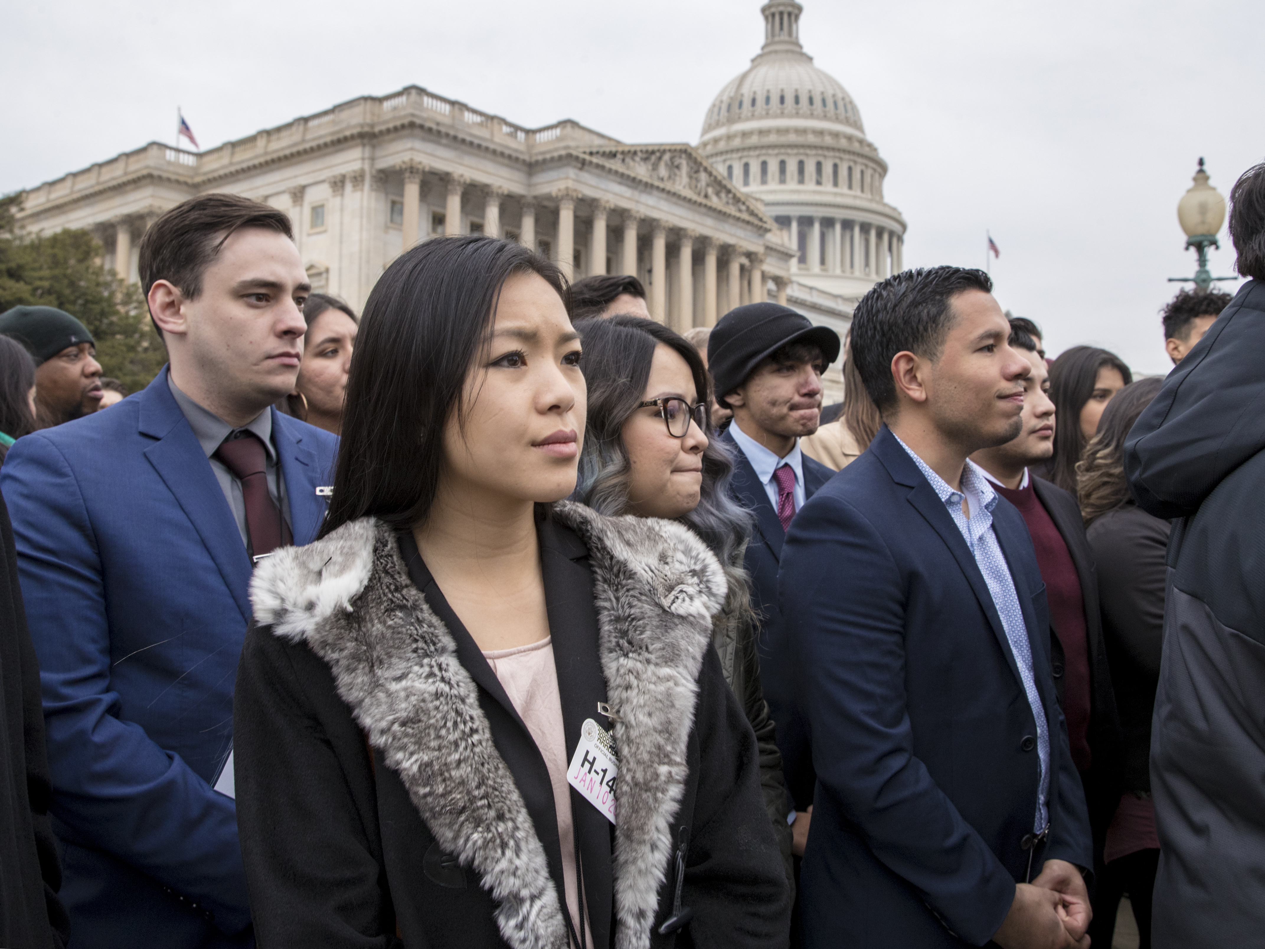caption: People brought to the U.S. illegally as children, known as DREAMers, and other supporters of the Deferred Action for Childhood Arrivals program listen as lawmakers speak at the U.S. Capitol.