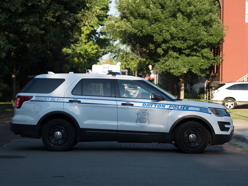 caption: A Dayton Police vehicle is viewed after an active shooter opened fire in the Oregon district in Dayton, Ohio on August 4, 2019.