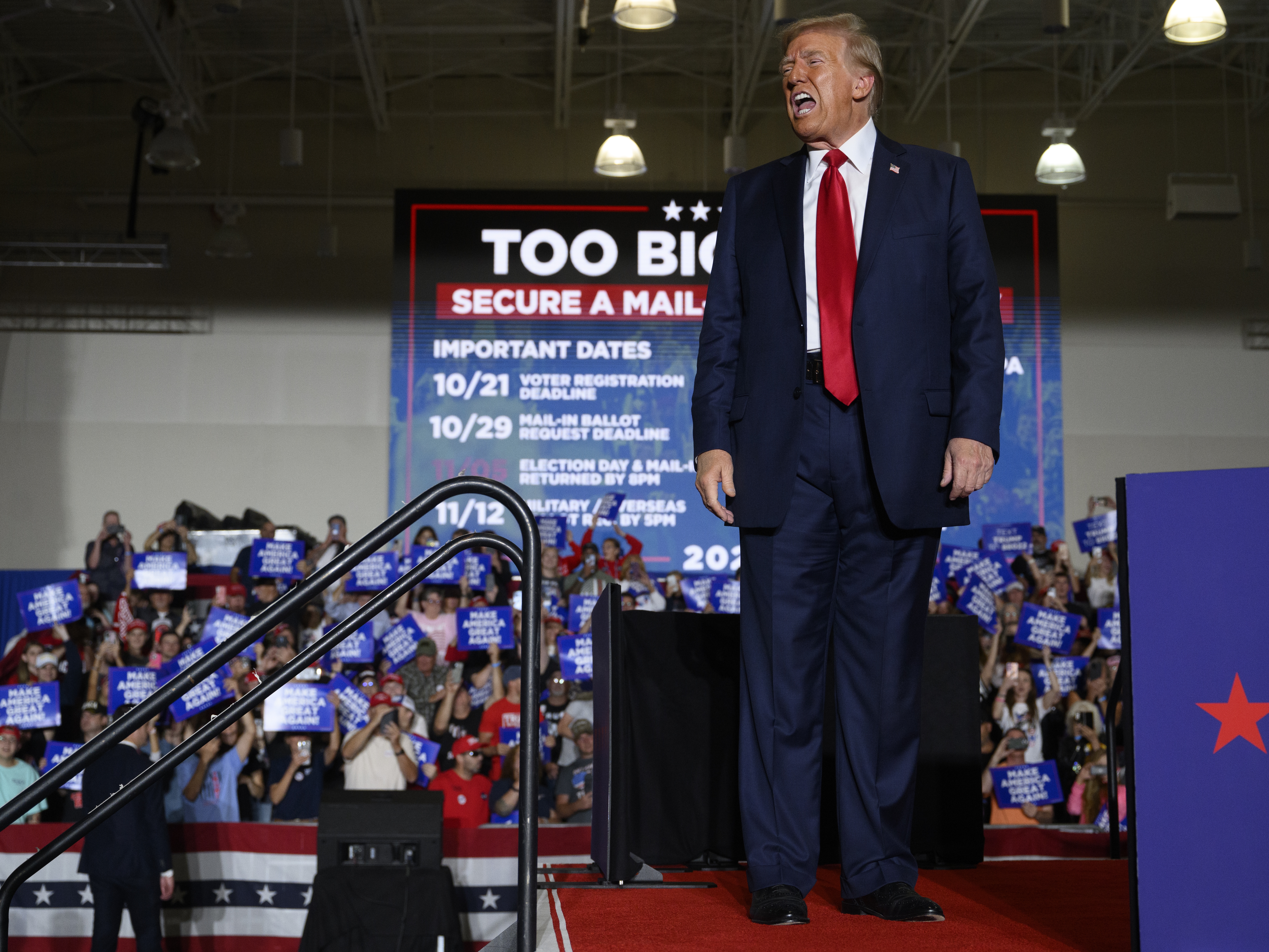 caption: Republican presidential nominee, former President Donald Trump speaks at a campaign rally Sunday in Erie, Pennsylvania. Trump continues to campaign in battleground swing states ahead of the final day of voting on November 5, Election Day.