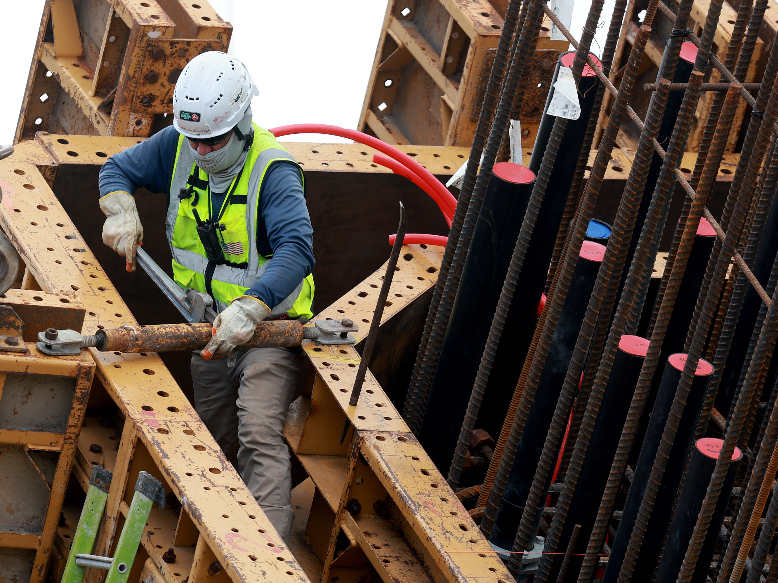 caption: A construction worker is seen in Miami on Jan. 5, 2024. U.S. employers added more jobs than expected in January including in the construction sector.