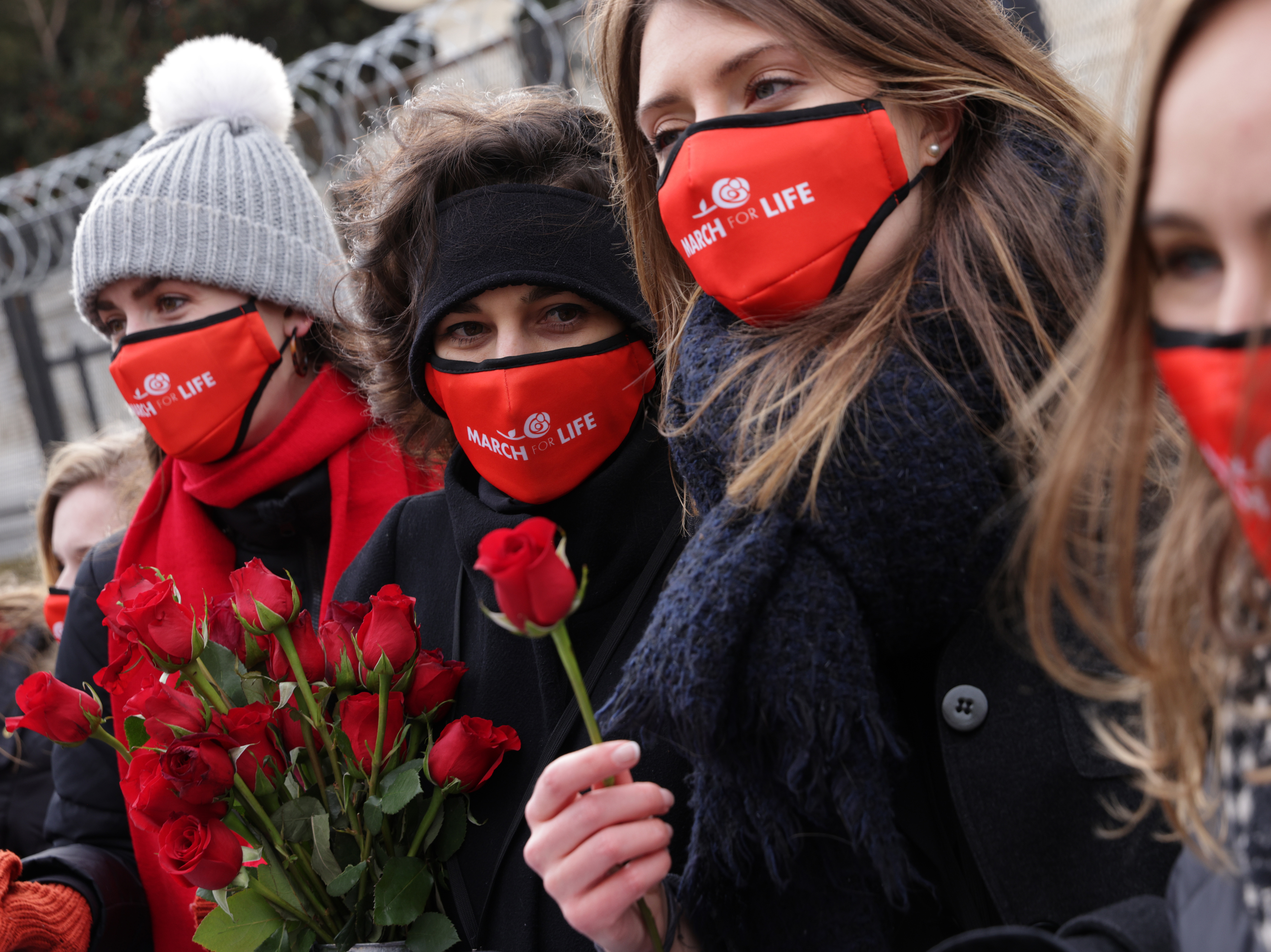 caption: Pro-life activists participate in the 48th annual March for Life outside the U.S. Supreme Court January 29, 2021 in Washington, D.C.