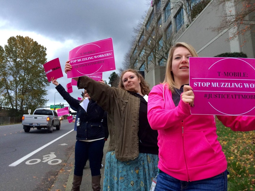 caption: T-Mobile employees protest outside the company's headquarters in Bellevue.